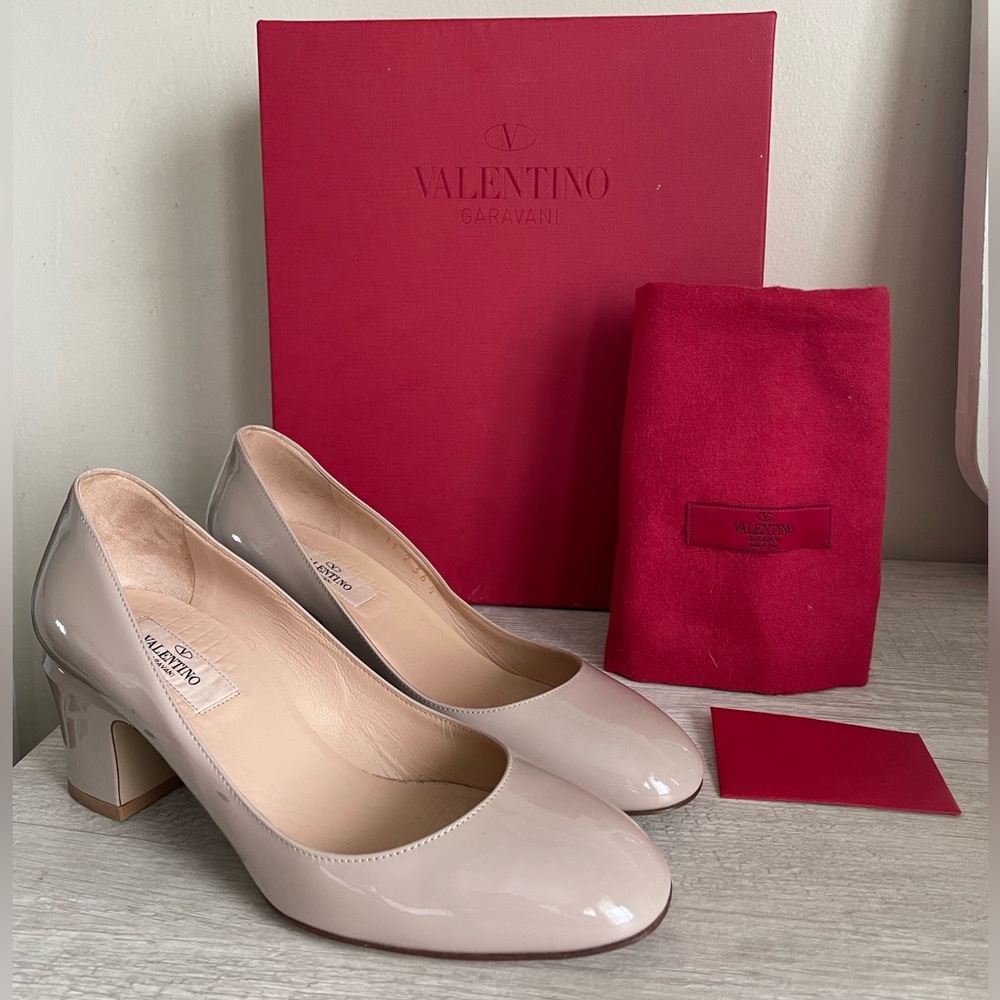 Authentic Valentino pumps. Pre-owned. Comes with box and dust bag.